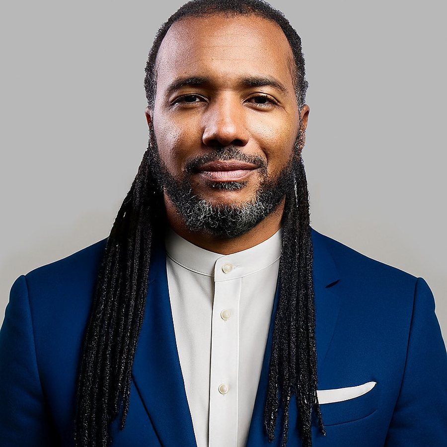 Usama Young in a navy suit